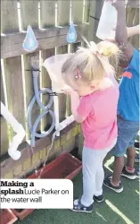  ??  ?? Making a splash Lucie Parker on the water wall