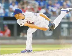  ?? Jim McIsaac / Getty Images ?? The Mets’ Zack Wheeler pitches in the sixth inning Saturday against the Nationals.