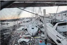  ?? DAVID GOLDMAN THE ASSOCIATED PRESS ?? Damaged boats sit among debris in a marina in the aftermath of hurricane Michael in Panama City, Fla., on Friday.