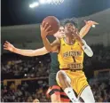  ??  ?? ASU's Remy Martin shoots a layup as Oregon State's Tres Tinkle defends during a Pac-12 game in Tempe on Feb. 22.