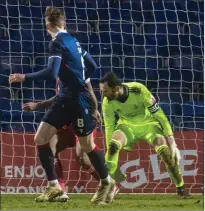  ??  ?? Aberdeen goalkeeper Joe Lewis watches Ross County’s third goal, by Oli Shaw, go by him