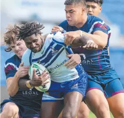  ?? ?? Ipswich SHS (Dark blue jersey) against Ignatius Park College