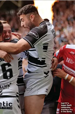  ?? ?? Hull FC’S Adam Swift celebrates scoring a try in the derby