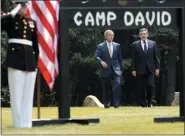  ?? CHARLES DHARAPAK — THE ASSOCIATED PRESS FILE ?? President George W. Bush, left, and British Prime Minister Gordon Brown walk to a joint press availabili­ty at Camp David, Md., July 30, 2007.