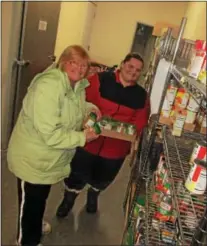  ?? PHOTO SPECIAL TO THE DISPATCH BY MIKE JAQUAYS ?? Volunteers, from left, Sue Wilcox and Megan Centore pose on Jan. 4at the Verona Food Pantry in Durhamvill­e.