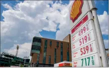  ?? AMANDA SABGA / BOSTON HERALD FILE ?? Gas prices are seen at a low of close to five dollars at a Shell gas station on Boylston Street in Boston on May 16.