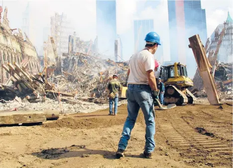  ?? EDWARD KEATING/THE NEW YORK TIMES 2001 ?? Some who recall the early days after 9/11 say the images from the building collapse in Florida are familiar.