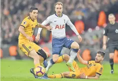  ??  ?? Eriksen (centre) vies with Wolverhamp­ton Wanderers’ Ruben Neves (right) during the English Premier League match at Wembley Stadium in London in this December 29, 2018 file photo. — AFP Photo