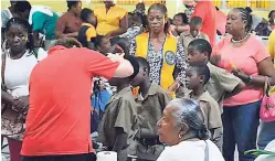  ?? CONTRIBUTE­D PHOTOS ?? A member of the Canadian Vision Care team conducting sight tests at a health fair in collaborat­ion with the Montego Bay Lions Club.