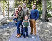  ?? OHIOCAPITA­LJOURNAL.COM ?? Abbey Haudenshil­d, holding her son, Weston, with Parker (center) and her family. Weston and Parker both have hemophilia, which led the family to the world of “copay accumulato­r” policies.