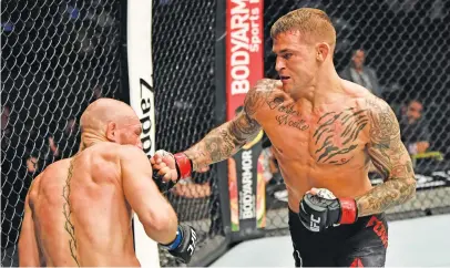  ?? Picture: Getty Images ?? THE END. American Dustin Poirier punches Conor McGregor of Ireland on the way to victory in their lightweigh­t fight during UFC257 at UFC Fight Island in Abu Dhabi yesterday.
