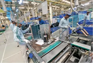  ?? Reuters ?? The Daikin Industries plant at Neemrana, Rajasthan. Indian manufactur­ing grew 5.3 per cent in the last quarter from a year ago, slower than an annual rise of 8.2 per cent in the December quarter. —