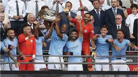  ??  ?? Manchester City players celebratin­g the Community Shield victory …yesterday