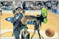  ?? AP ?? AIR JORDAN: Miami’s Jordan Miller jams home two of his 13 points Friday in a Sweet 16 win over Houston.