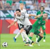  ?? AP ?? Ilkay Gundogan (left) vies for the ball against Saudi Arabia.