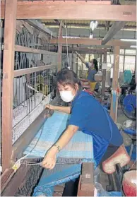  ??  ?? Workers produce ceramic cups as foreign diplomats observe their skills at a factory under the Doi Tung Developmen­t Project in Chiang Rai.