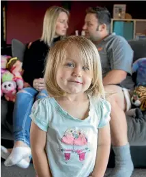  ?? PHOTO: FAIRFAX NZ ?? Roy and Amelia Peters with daughter Livia, 2. Livia is recovering from a severe E coli infection, caught from their contaminat­ed drinking water.