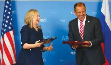  ?? (Reuters) ?? IN HAPPIER times. Then-US secretary of state Hillary Clinton and Russian Foreign Minister Sergei Lavrov in 2012 at a meeting in Vladivosto­k.