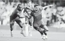  ?? ASSOCIATED PRESS FILE PHOTO ?? Chelsea's Victor Moses, pictured left, challenges Liverpool's Trent Alexander-Arnold during a May 6 soccer match.