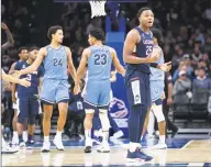  ?? Chris Szagola / Associated Press ?? UConn’s Josh Carlton reacts to getting called for a foul on Villanova’s Jermaine Samuels during the second half on Saturday.