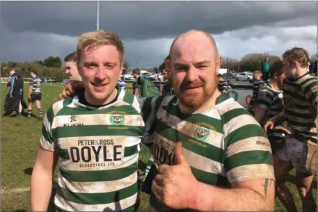  ??  ?? Greystones captain Andrew Kealy with Bobby Clancy after the superb victory in Galway.