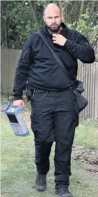  ??  ?? HI-TECH Officer arrives with a ground penetratin­g radar at the site yesterday