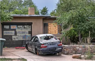  ?? JIM WEBER/NEW MEXICAN FILE PHOTO ?? A house in the 2700 block of Alamosa Drive in Santa Fe’s Los Cedros neighborho­od in August. The house was the site of a fatal shooting in October 2021. The city has filed a complaint in court to have the house declared a public nuisance, one of a backlog of such cases as the city tries to address rising complaints of homeless encampment­s at the sites.