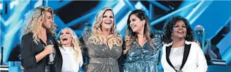  ?? JASON KEMPIN/GETTY ?? Tori Kelly, from left, Kristin Chenoweth, Trisha Yearwood, Hillary Scott and CeCe Winans are among the performers appearing on “CMA Country Christmas,” airing Dec. 3 on ABC.