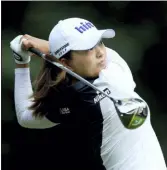  ?? STEVEN PASTON — PA VIA AP ?? South Korea’s Jin Young Ko plays off the 7th tee on day two of the Women’s British Open at Woburn Golf Club in Little Brickhill, England on Friday.