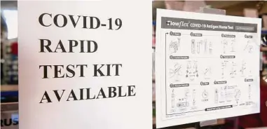  ?? Ned Gerard / Hearst Connecticu­t Media file photo ?? COVID-19 antigen home test kits available at one of the Hancock Pharmacy locations in Bridgeport last year. Experts are seeing a decline in the number of Connecticu­t COVID-19 cases, a trend they say they hope continues.
