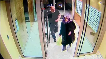  ?? AP ?? CCTV video shows Saudi writer Jamal Khashoggi and his fiancee, Hatice Cengiz, at an apartment building in Istanbul, Turkey, just hours before his death in the Saudi Arabian Consulate.