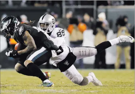  ?? Michael Perez ?? The Associated Press Eagles cornerback Ronald Darby, left, intercepts a pass in front of Raiders wide receiver Amari Cooper in the fourth quarter of Philadelph­ia’s 19-10 victory Monday night at Lincoln Financial Field. The Raiders had five second-half...