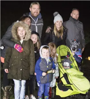  ?? PHOTOS BY BARBARA FLYNN ?? The Doyles and the O’Shaughness­ys head off on the candlelit walk organised by Roundwood AFC by the reservoir.