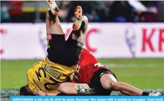  ??  ?? CHRISTCHUR­CH: In this July 28, 2018 file photo, Huricanes’ Wes Goosen (left) is tackled by Crusaders’ David Havili during the Super Rugby semi-final match between New Zealand’s Canterbury Crusaders and Wellington Hurricanes at the AMI Stadium. — AFP