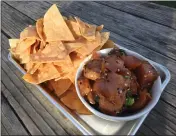  ??  ?? Albacore poke and chips are served at Hook Fish.
