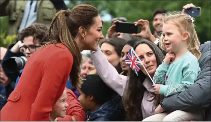  ?? ?? CROWD PLEASER: The Duchess of Cambridge meets a thrilled young girl at Cardiff Castle