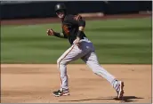  ?? ASHLEY LANDIS — THE ASSOCIATED PRESS ?? The San Francisco Giants’ Evan Longoria (10) runs to third base during a spring training game against the Arizona Diamondbac­ks on Sunday in Scottdale, Ariz.