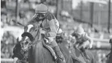  ?? DARRON CUMMINGS/AP ?? John Velazquez rides Authentic to victory Saturday in the Breeders’ Cup Classic.