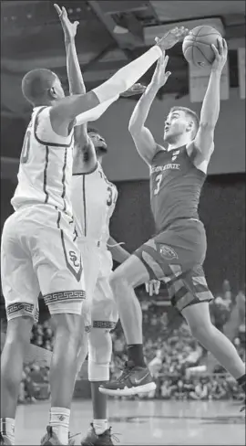  ?? Marcio Jose Sanchez Associated Press ?? OREGON STATE’S Tres Tinkle drives to the basket against USC during the first half. Tinkle finished with 14 points and 13 rebounds in the Beavers’ 67-62 victory.