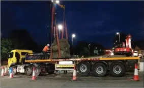  ??  ?? Michael Quane’s ‘Horse and Riders’ statue being moved from Annabella ahead of realignmen­t works at the roundabout. Photo: Pakie O’Donoghue.