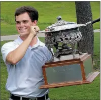  ?? Special to the Democrat-Gazette/ROBERT YATES ?? Little Rock’s Miles Smith displays his trophy after defeating Luke Cornett of Drasco 3-and-2 in the final of the 52nd annual Arkansas State Golf Associatio­n Men’s Match Play Championsh­ip on Sunday morning at Harbor Oaks Golf Club.