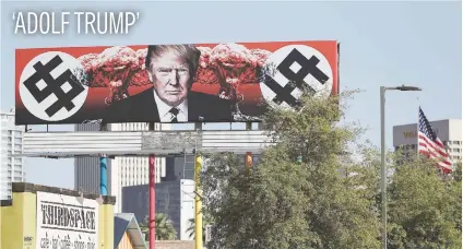  ?? Picture: Getty Images ?? An anti-Trump billboard displaying swastika-like dollar signs in Phoenix, Arizona. Artist Karen Fiorito created the piece on commission from Phoenix art gallery La Melgosa.