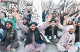  ??  ?? QUETTA: Activists of Jamiat Ulema-e Islam Nazryate party shout as they celebrate the signing agreement between the US and the Taleban during a rally in Quetta yesterday. —AFP