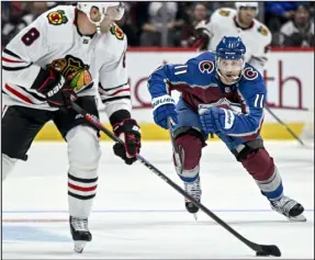  ?? AARON ONTIVEROZ — THE DENVER POST ?? The Avalanche’s Andrew Cogliano, right, defends the Blackhawks’ Jack Johnson during the first period Oct. 12 at Ball Arena in Denver.