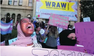  ?? Daniel Pockett/Getty Images ?? Young women gather at a rally for Internatio­nal Women’s Day in Melbourne, Australia. The movement for a women’s history month is gathering steam.