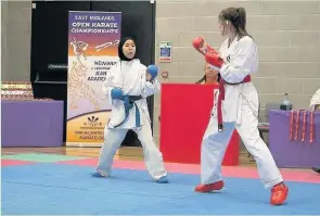  ??  ?? Rafidah Rosli in action in the kumite against Eleanor Beatty from Simon Coope Karate Loughborou­gh (Photo by Stephen Hayward)