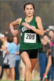  ?? RANDY MEYERS — THE MORNING JOURNAL FILE ?? Erica Francescon­i of Westlake is all alone in first place at the finish of the Division I District cross country meet.