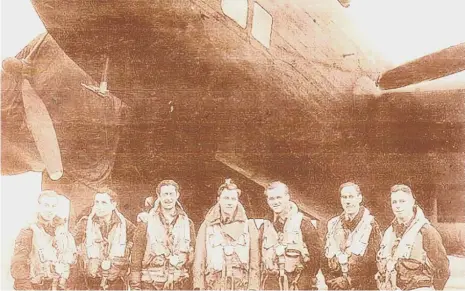  ??  ?? Mr Vanderveld­e, second from left, pictured with his crewmates and their Halifax bomber during his Second World War service.