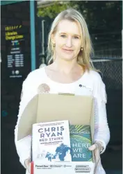  ??  ?? Warragul Library’s Emma Fawcett prepares a box of books for home delivery as the staged reopening of the library begins. A click and collect service is now available at Warragul Library.