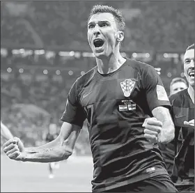  ?? Mario Mandzukic’s goal AP/FRANK AUGSTEIN ?? in the 109th minute gave Croatia a come-from-behind, 2-1 victory over England and sent it into Sunday’s World Cup championsh­ip match against France.